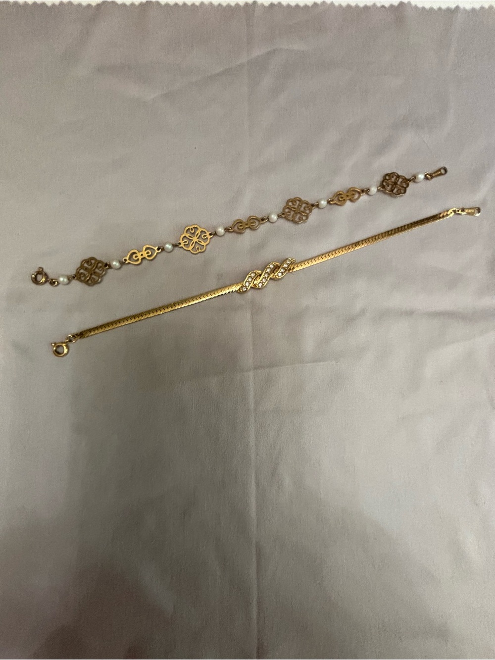 Avon Gold Tone Women's Bracelets with Pearl Accents and rhinestones.